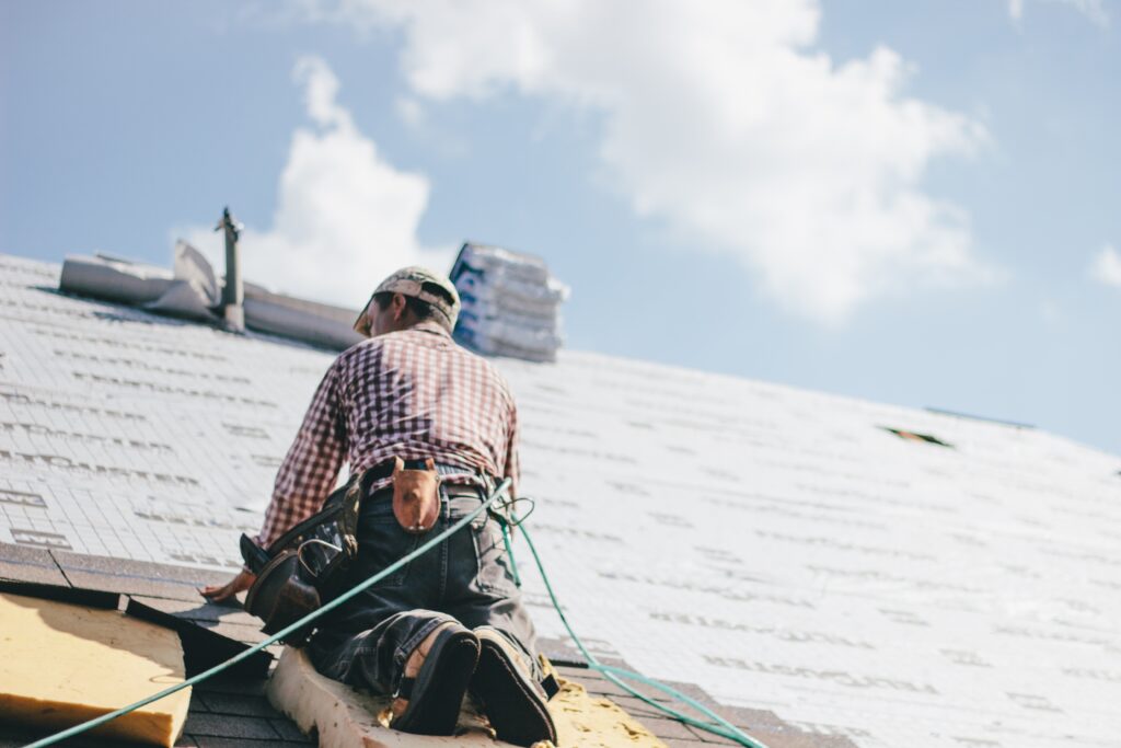 roofer-adding-shingles-to-the-roof-of-a-houseQuestions-to-Ask-a-Roofer-Before-You-Hire-Them-berry-roofing