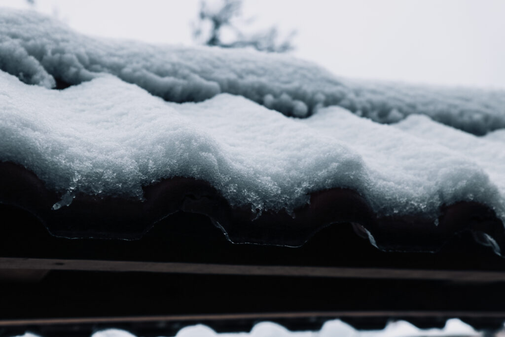 Winter-Roof-Maintenance-During-the-Coldest-Months-snowy-background-berry-roofing-solar