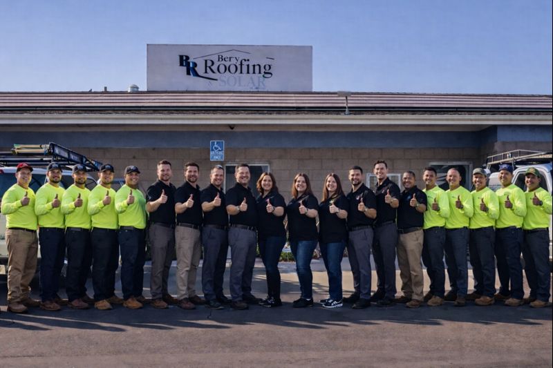Berry Roofing and Solar team standing together with thumbs up in front of their Riverside California office