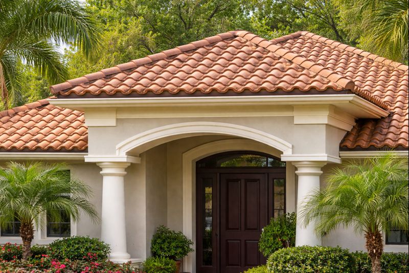 Front entry residential home with clay tile roofing system installed in Southern California