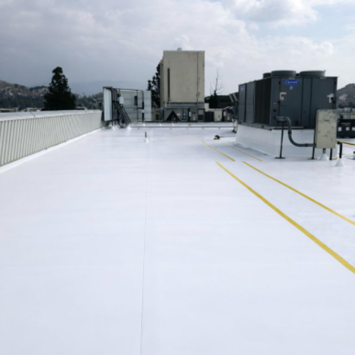 Commercial TPO roofing system with walk pads in Riverside, California